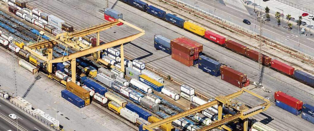 trainyard from above with ISO tanker trailers visible
